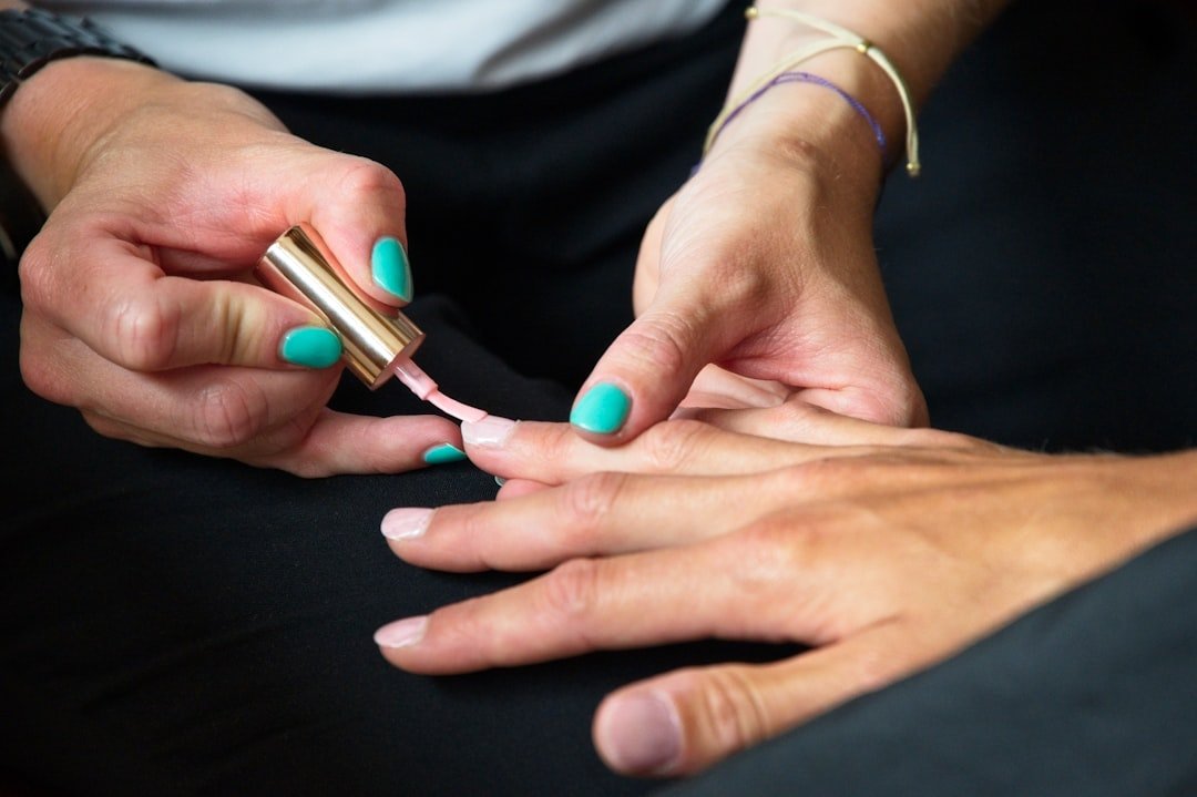 Gel nail polish being removed with a careful process