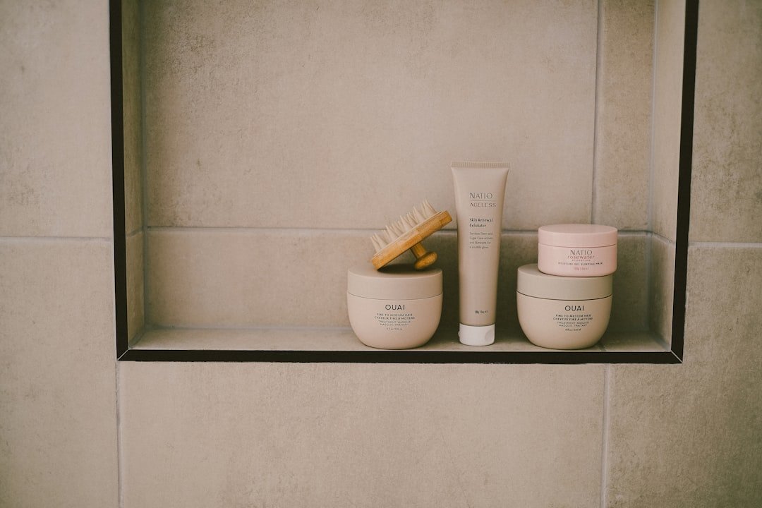 Minimal gentle skincare products on a bathroom shelf