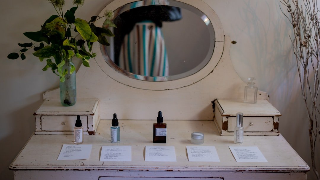 Vintage vanity with skincare products and flowers